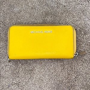 Yellow Michael Kors wallet.